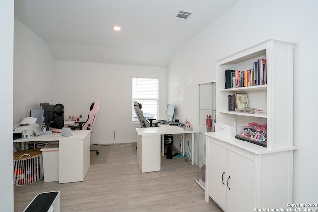 home office with vaulted ceiling, light wood-type flooring, visible vents, and recessed lighting