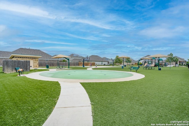 surrounding community featuring playground community, a yard, and fence