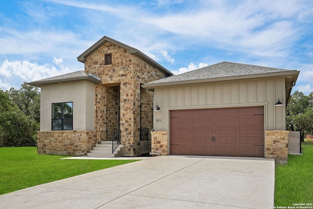 view of front facade featuring a garage and a front lawn