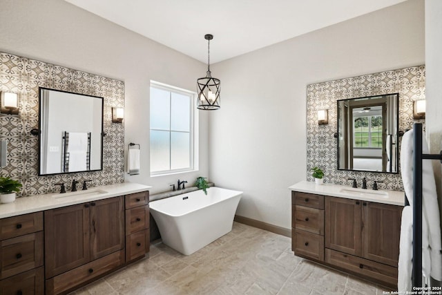 bathroom with tasteful backsplash, vanity, and a tub