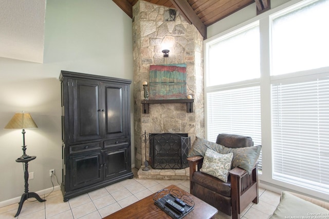 tiled living room with vaulted ceiling with beams, wood ceiling, a fireplace, and a wealth of natural light