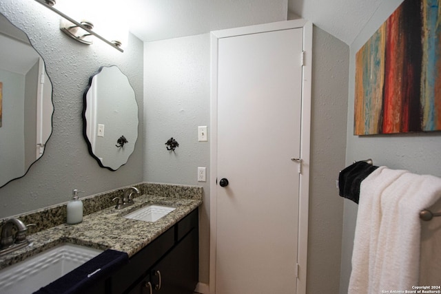 bathroom featuring double vanity