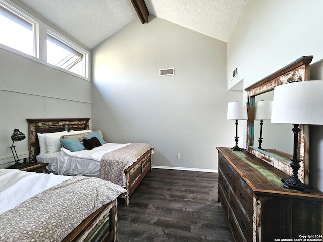 bedroom featuring beam ceiling, dark hardwood / wood-style floors, a textured ceiling, and high vaulted ceiling