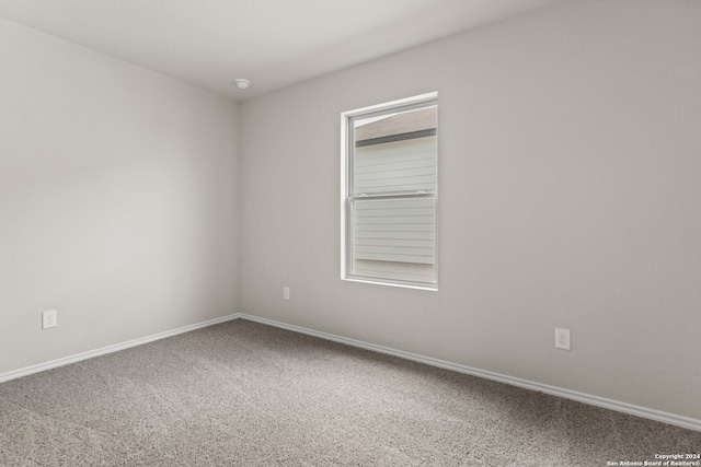 spare room featuring carpet