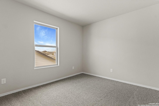 empty room with carpet flooring