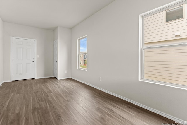 unfurnished room featuring wood-type flooring