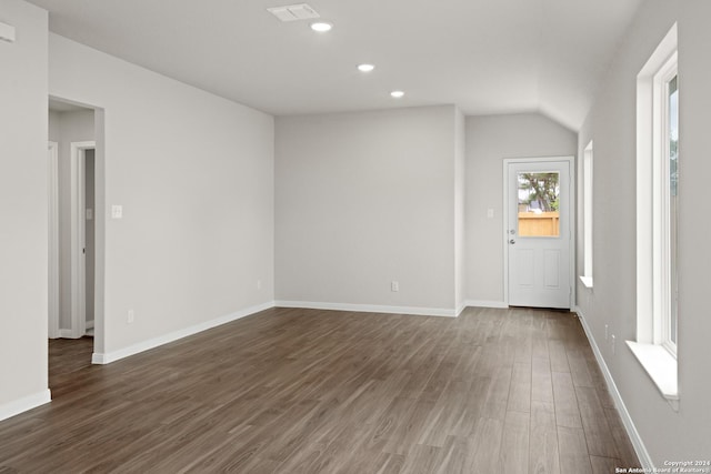 entryway featuring dark hardwood / wood-style flooring and vaulted ceiling