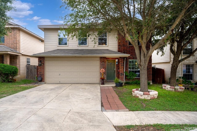 view of front property with a garage and a front lawn