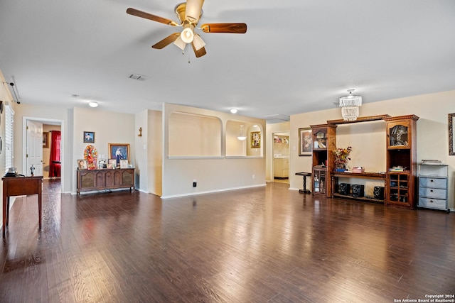 living room featuring ceiling fan and dark hardwood / wood-style flooring