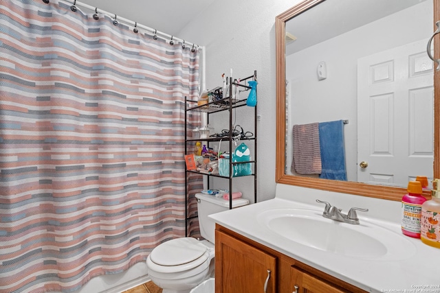 bathroom featuring toilet and vanity