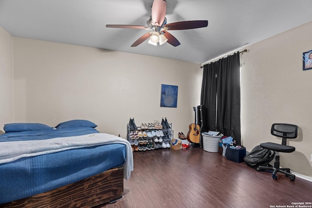 bedroom with ceiling fan and dark hardwood / wood-style floors