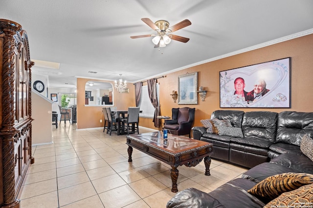 living room featuring light tile patterned floors, ceiling fan with notable chandelier, and ornamental molding