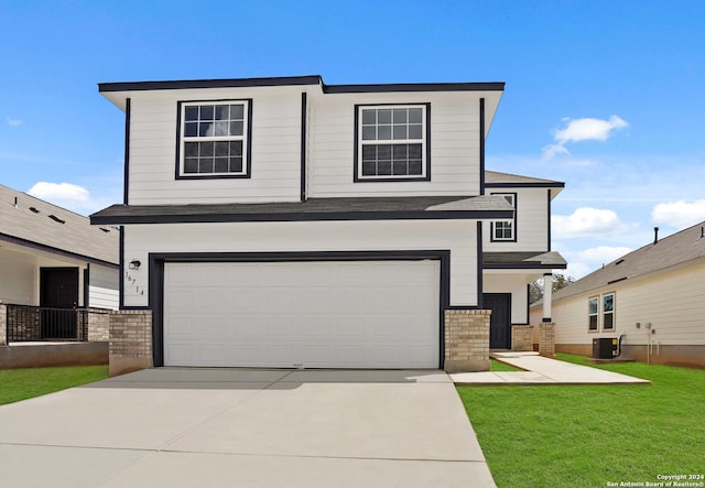 view of front of house with a garage, a front lawn, and central air condition unit