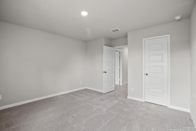 unfurnished bedroom with light colored carpet