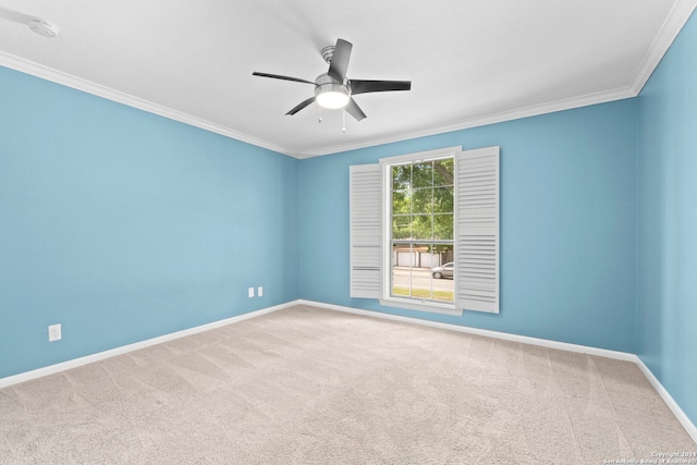 unfurnished room featuring carpet floors, ceiling fan, and crown molding