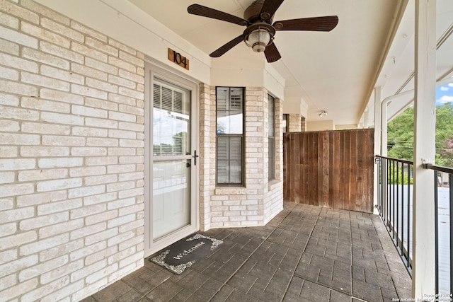 property entrance featuring ceiling fan