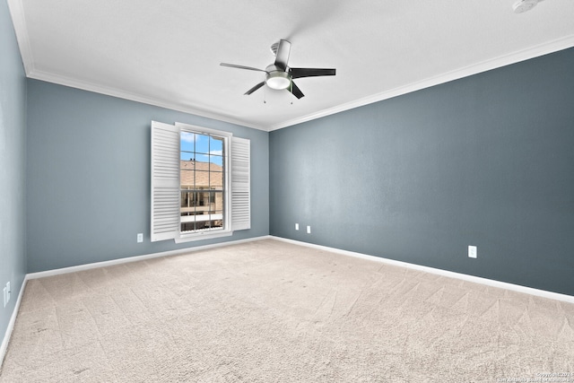 carpeted empty room with ceiling fan and ornamental molding