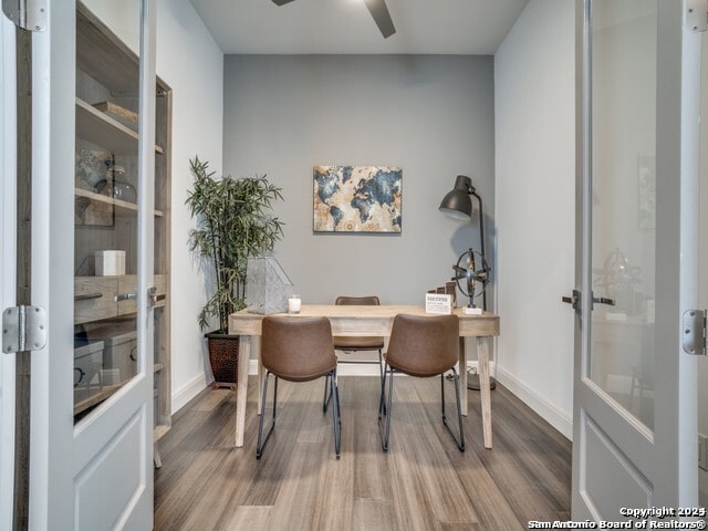 office area with hardwood / wood-style floors and ceiling fan