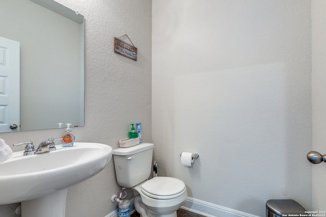 bathroom with sink and toilet