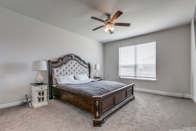 bedroom with light carpet and ceiling fan