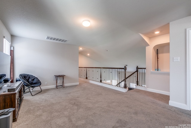 living area with light carpet