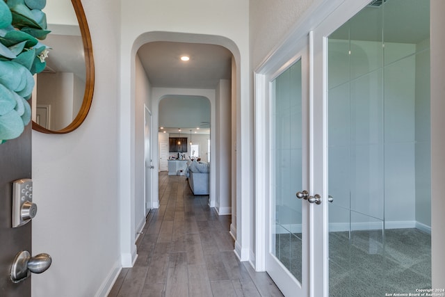 corridor featuring hardwood / wood-style flooring