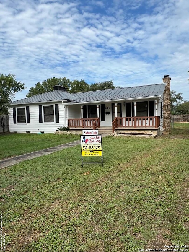 single story home with a front yard and a porch