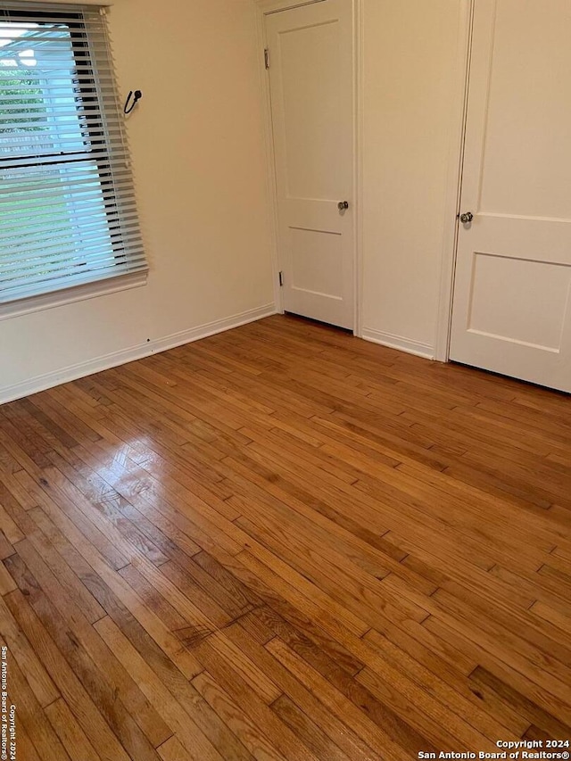 unfurnished room with light hardwood / wood-style floors