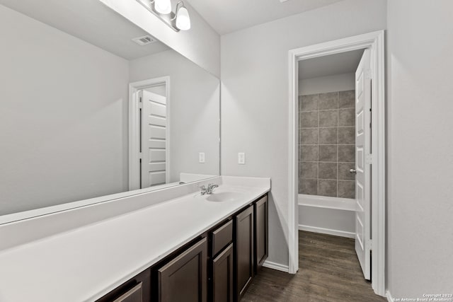 bathroom with vanity and hardwood / wood-style flooring