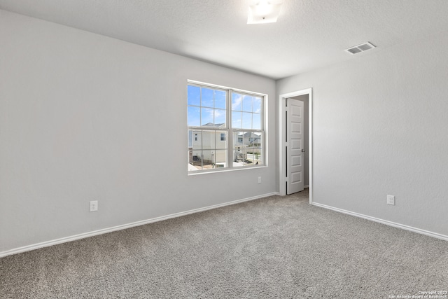 empty room featuring carpet