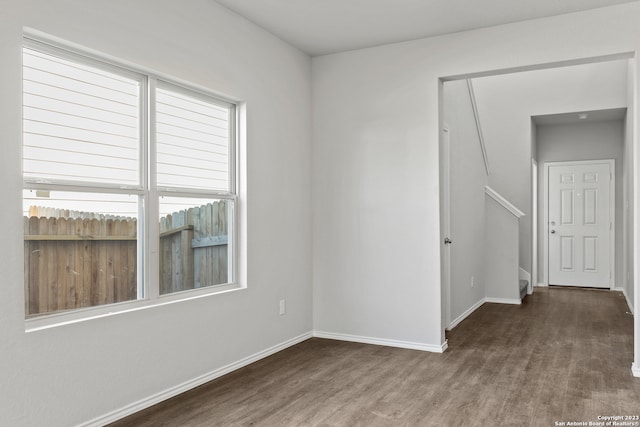 spare room featuring dark hardwood / wood-style flooring