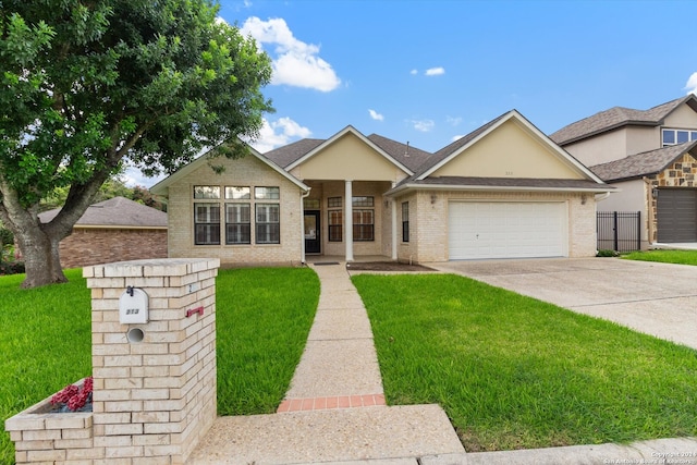 view of front of house featuring a garage and a front lawn