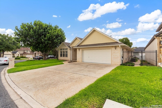 view of front facade with a front yard and a garage