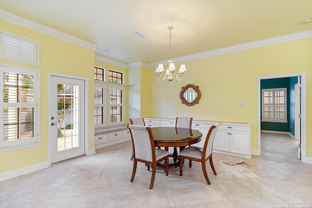 tiled dining room with ornamental molding and a chandelier