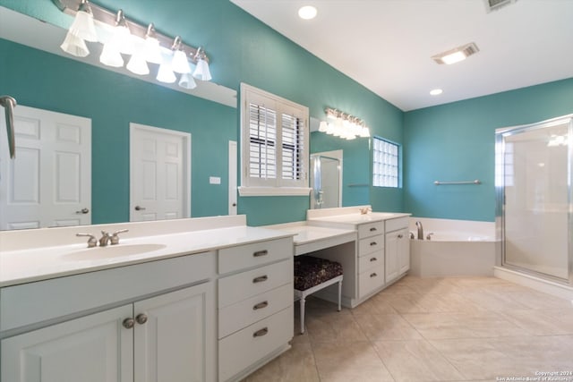 bathroom featuring vanity, shower with separate bathtub, and tile patterned flooring