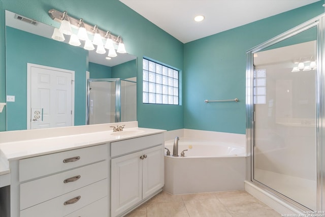 bathroom with vanity, tile patterned floors, and separate shower and tub