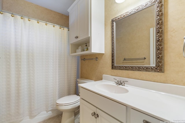 bathroom with vanity, toilet, and tile patterned floors