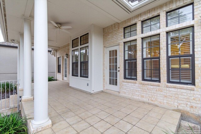 view of patio featuring ceiling fan