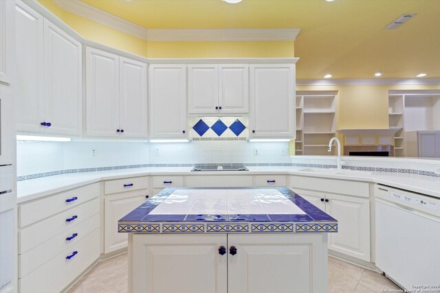 kitchen featuring ornamental molding, white dishwasher, sink, and white cabinets