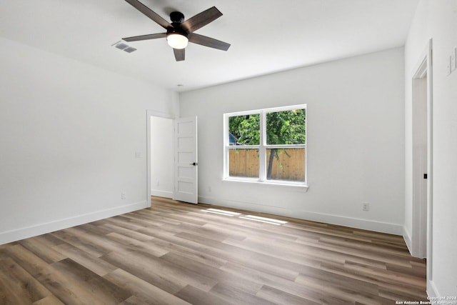 unfurnished bedroom with ceiling fan and light hardwood / wood-style floors