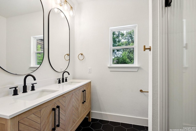 bathroom with vanity and tile patterned floors