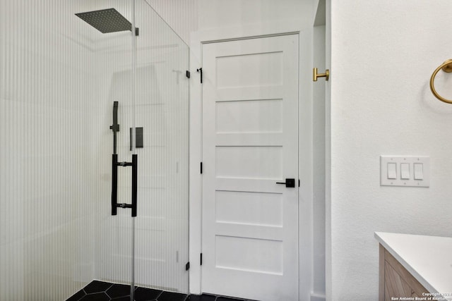 bathroom with vanity and a shower