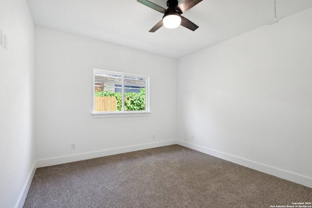 spare room with carpet flooring and ceiling fan