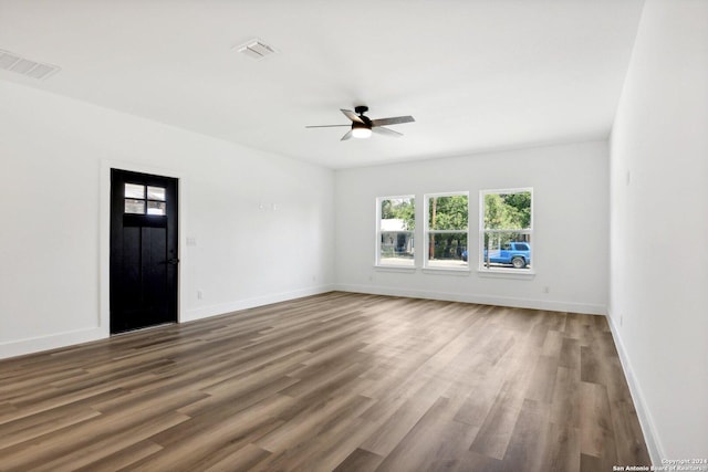 spare room featuring ceiling fan and wood-type flooring