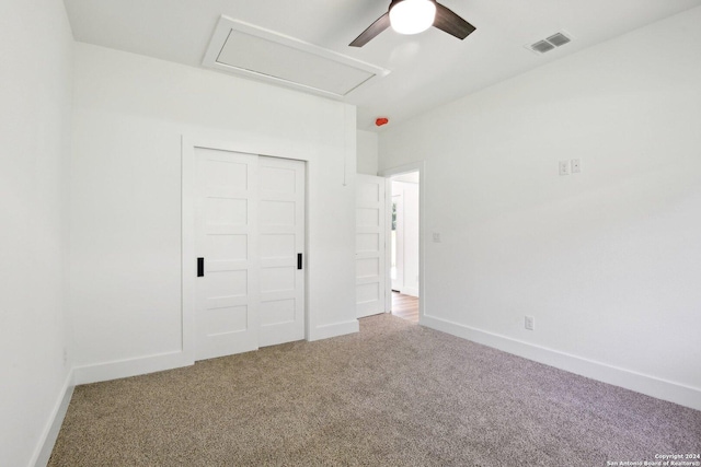 unfurnished bedroom with carpet floors, a closet, and ceiling fan