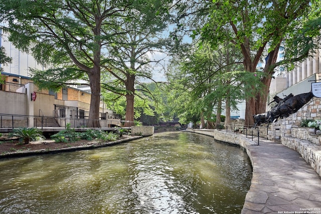 surrounding community with a water view