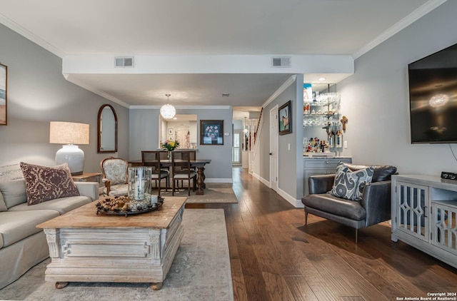 living room featuring crown molding and dark hardwood / wood-style flooring