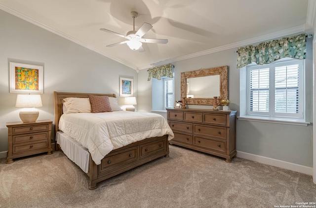 carpeted bedroom with crown molding, vaulted ceiling, and ceiling fan