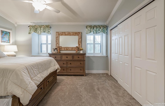 bedroom featuring crown molding, light colored carpet, a closet, and ceiling fan