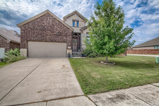 view of front of home featuring a front lawn and a garage